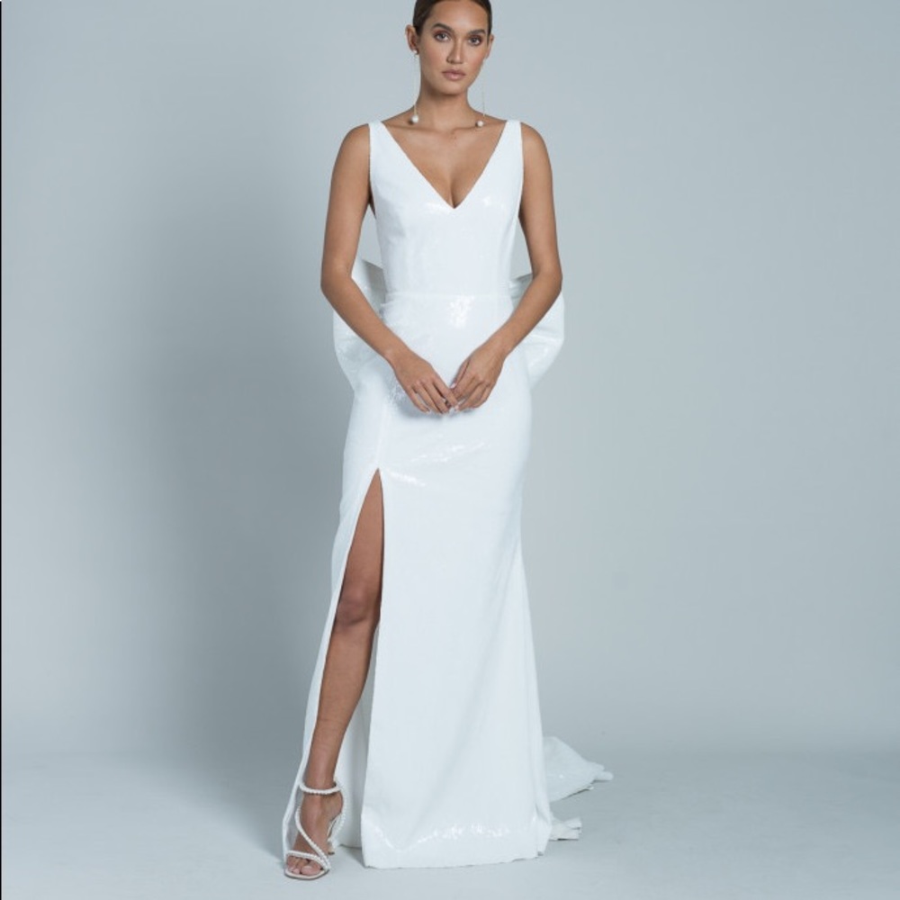White low back bow gown with high slit: Rime Arodaky